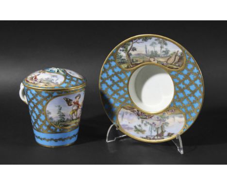 SEVRES CHOCOLATE CUP, COVER AND TREMBLEUSE SAUCER, date code x, the cup painted with a scene of children squabbling over a pu