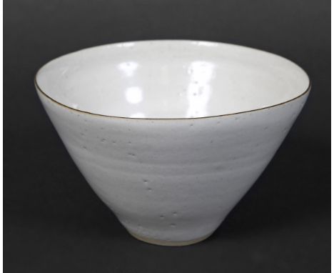 LUCIE RIE (1902-1995) a small stoneware bowl with a pale grey glaze and thin manganese rim, the footrim wiped clear of glaze.