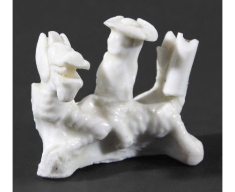 TWO CHINESE BLANC DE CHINE WHISTLES, 17th century, the first depicting a Dutchman in a tricorn hat riding a dragon, length 5.