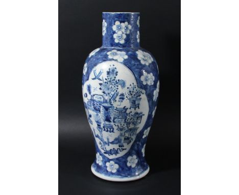 CHINESE BLUE AND WHITE BALUSTER VASE, Kangxi style but later, painted with cartouches of vases, koro and other ornaments on a