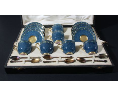 ROYAL WORCESTER CASED COFFEE SET, circa 1925, with enamelled meandering foliage on a powder blue ground, silver gilt spoons, 