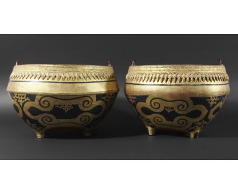 PAIR OF TIBETAN LACQUERED PAPIER MACHE SERVING BOWLS, late 19th or early 20th century, decorated in gilt and black beneath a 