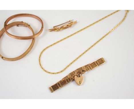 AN 18CT GOLD FANCY LINK NECKLACE 39cm long, 18.3 grams, a 15ct. gold knot brooch, 5.5cm long, 4.7 grams, a 9ct. gold gate lin