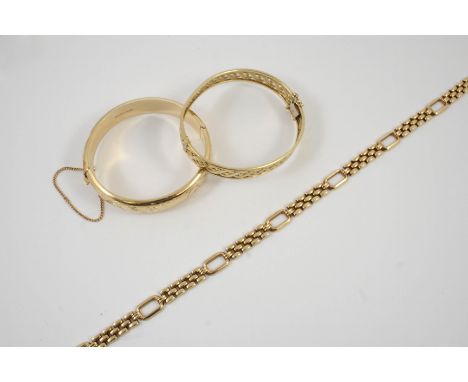 A 9CT GOLD FANCY LINK NECKLACE 41.5cm long, 26 grams, together with a 9ct. gold openwork hinged bangle, 19.7 grams, and a 9ct
