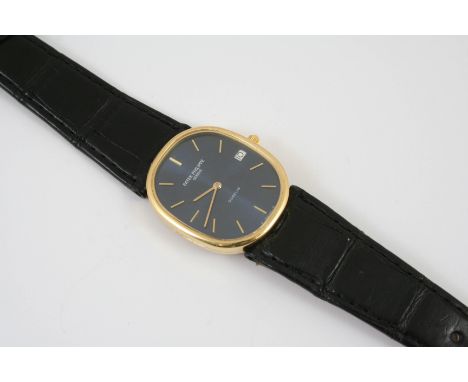 A GENTLEMAN'S 18CT GOLD ELLIPSE WRISTWATCH BY PATEK PHILIPPE the signed oval-shaped dial with baton numerals and date apertur