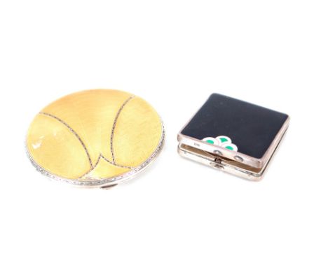 An Art Deco silver and enamel compact, 5cm x 5cm approx. 64gms; and an Art Deco silver and enamel decorated compact AF, appro