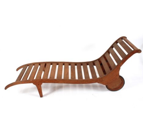 A Heals of London early 20th Century teak garden lounger with Heal &amp; Sons Ltd. London button, approx. 178cm x 52cm&nbsp; 