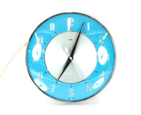 A Metamec circular electric wall clock, 20cm dia.