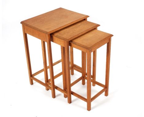 A nest of three light oak occasional tables, the largest 42cm x 30cm x 56cm high 