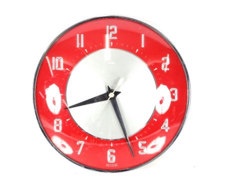 A Metamec circular electric wall clock, 20cm dia.