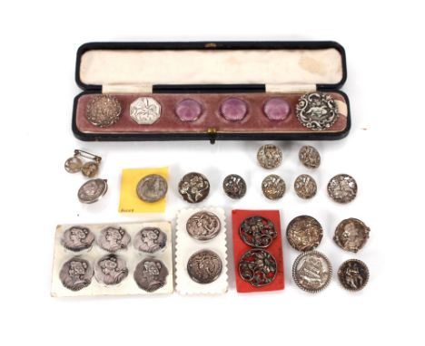 A set of six white metal Art Nouveau buttons; a pair of silver buttons decorated with fashionable females; five silver button