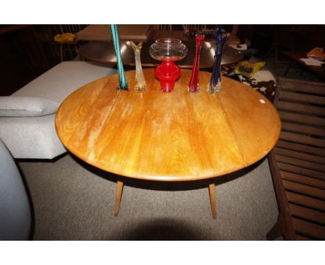 A light Ercol drop leaf, 124cm x 112cm x 71cm high 