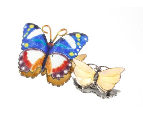 Two Norwegian silver and blue enamel decorated leaf shaped brooches; a silver and green enamel brooch; a Norwegian Sterling s
