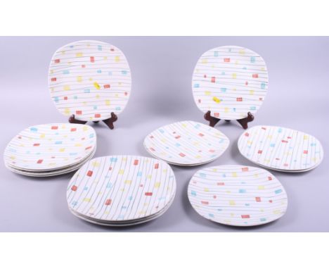 A collection of 1950s Midwinter "Magic Moments" pattern plates, designed by Jessie Tait, including eight dinner and four side