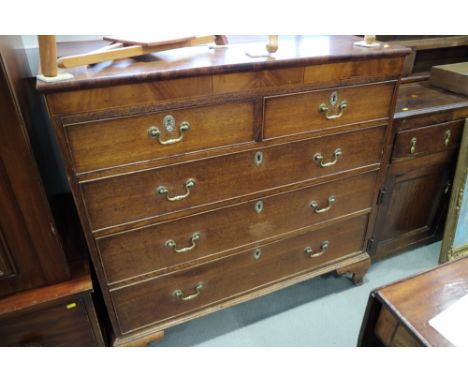 A 19th century oak and mahogany chest of two short and three long graduated drawers, on ogee bracket supports, 44" wide