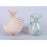 A Roman glass jug, 5" high (chip to rim), and a similar terracotta jug, 6 1/2" high (chip to rim)