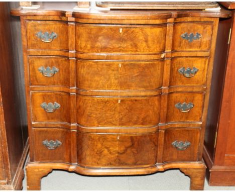 A walnut serpentine front chest of four long graduated drawers, on bracket feet, 35" wide x 34 1/2" high Condition report:Min