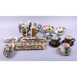 A collection of Celtic studio pottery including six cups, in sizes, a jug, a vase, dishes, etc