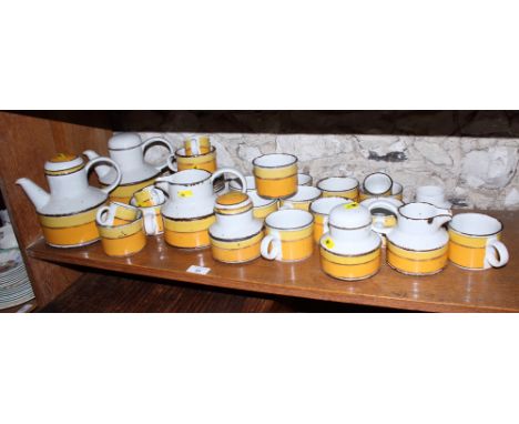 A Midwinter Stonehenge "Sun" pattern tea service, including two teapots, a milk jug, sugar (restoration to rim) and cream, fi