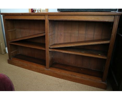 An Edwardian oak two-section bookcase with adjustable shelves, on block base, 75" wide x 40 1/2" high x 12" deep. shelves are