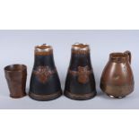 A pair of Doulton Lambeth siliconware "Black Jack" jugs with applied silver rims, 7 1/2" high, and a