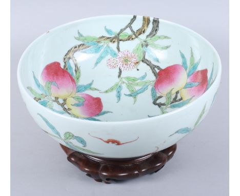 A Chinese porcelain punch bowl, decorated bats and peaches, seal mark to base, 12" dia, on hardwood stand Condition report:Th