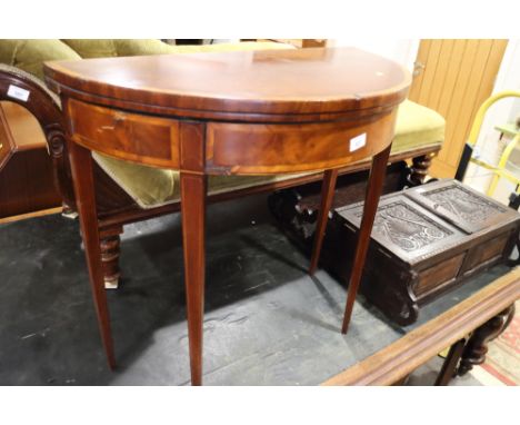 An Edwardian mahogany and satinwood banded semicircular fold-over top card table, on square taper supports, 29" wide