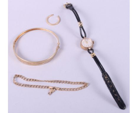 A 9ct gold bangle and a 9ct gold bracelet, 11.5g, an 18ct gold ring shank, 1.8g, and a lady's 9ct gold cased wristwatch