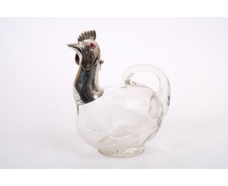 Edwardian claret jug with silver mount in the form of a chicken's head, with clear glass body, integral handle and star cut p