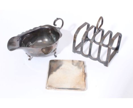 1920s silver sauce boat of conventional form, with open scroll handle (Birmingham 1927), maker - W.G., together with a 1930s 