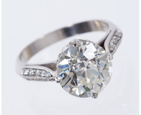 Fine diamond single stone ring, the old cut diamond weighing approximately 3.79cts in four claw setting with diamond set gall