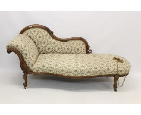 Victorian walnut chaise longue with leaf scroll carved show-wood frame and floral tapestry upholstery on cabriole legs and ca