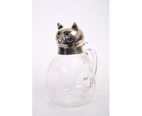 Victorian claret jug with silver mount in the form of a cat's head with glass eyes (registration mark), clear glass dimple bo