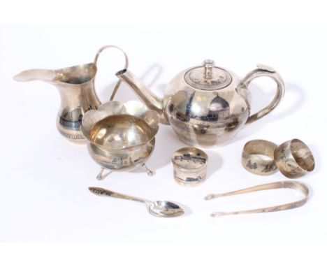 Middle Eastern three piece white metal tea set - comprising teapot of bullet form, with niello work decoration of boats and b