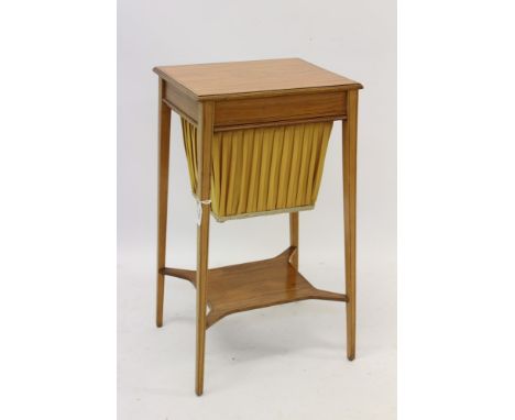 Regency-style satinwood worktable with patera inlaid top and work-in-progress basket, on square tapered legs united by a shel