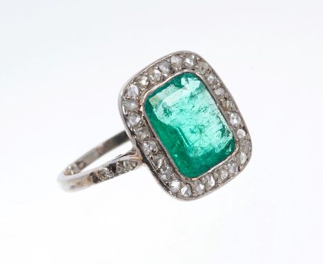 Art Deco emerald and diamond ring, the rectangular step cut emerald measuring approximately 8.8 x 7 x 3.2mm, surrounded by a 