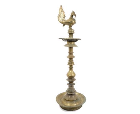 Antique Indian Deccan brass oil lamp with cockerel finial and five spouted reserve on knopped column and dished base, 67cm hi
