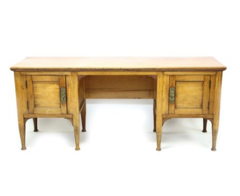 Rare Arts & Crafts fruitwood desk with expansive moulded top , oval dual pedestal ends fitted with cupboards, left cupboard e