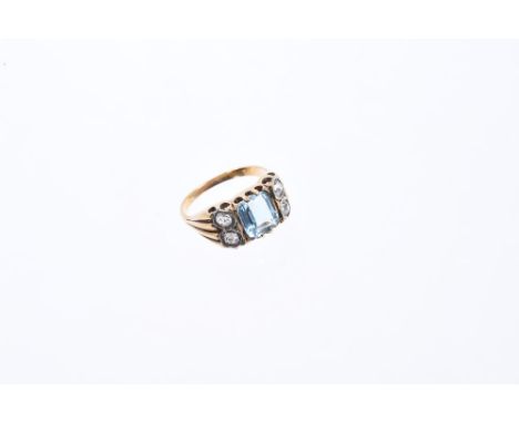 Aquamarine and diamond ring, the central step cut aquamarine weighing approximately 1.33cts flanked by four brilliant cut dia