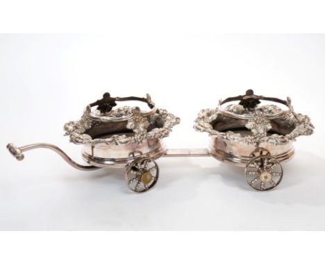 Early 19th century Old Sheffield Plate decanter trolley with unusual revolving coasters with heavy grape and vine decoration 