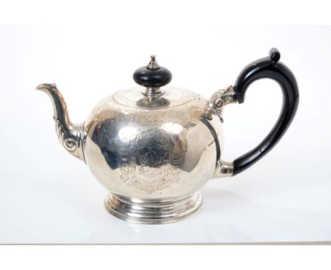 George V silver teapot of bullet form, in the Georgian style, with engraved foliate decoration, leaf mounted spout, ebonised 