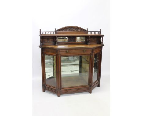 Good late 19th century walnut credenza, by Gillow & Co., in the Aesthetic style, of trapezoidal form, the mirrored shelf back