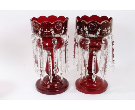 Pair of Mid-19th Century ruby glass lustres with gilt and enamel floral spray decoration and prismatic glass drops, 34cm COND