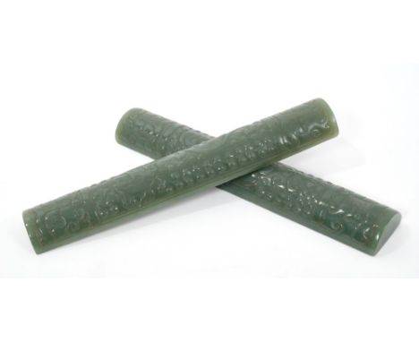 Pair Chinese carved green jade scroll weights of demi lune section with carved archaic animal and scroll decoration, 19cm