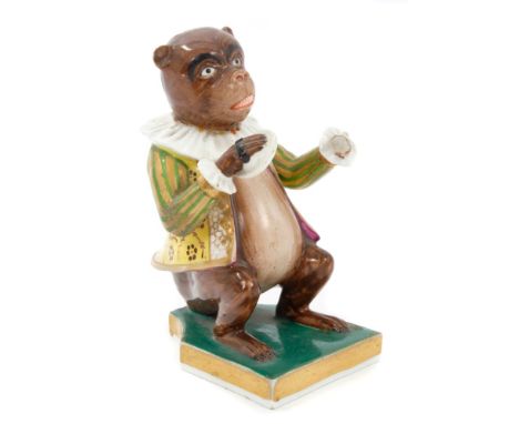 Early 19th century Derby monkey musician holding a cymbal and wearing a ruff around his neck and yellow, green and gold jacke