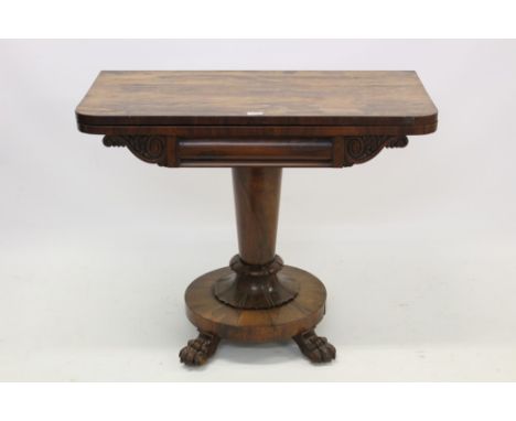 William IV rosewood card table, the rounded rectangular hinged top enclosing baize-lined playing surface on tapering lotus ca
