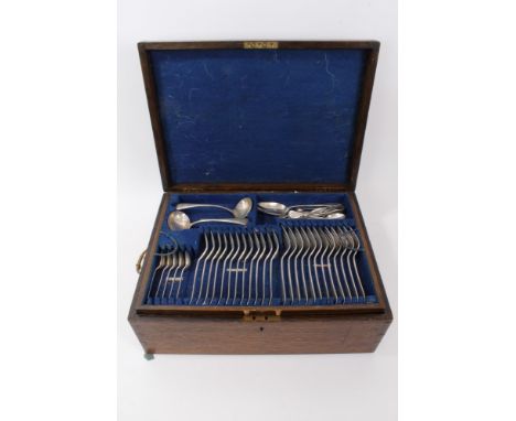 George V silver Old English pattern table service with engraved initial G in an oak canteen, comprising twelve table forks, t