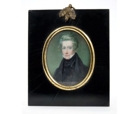 English School, circa 1840: Miniature portrait on ivory depicting a young man in black coat and collar, oval, 9 x 7cm, black 