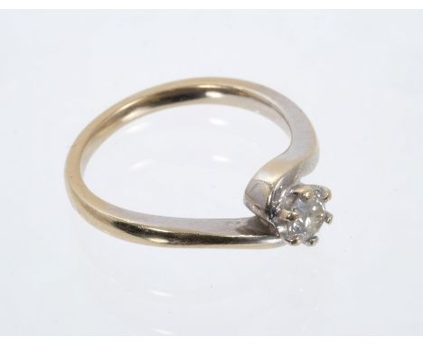 Diamond single stone ring with a brilliant cut diamond estimated to weigh approximately 0.23cts in crossover setting on 18ct 