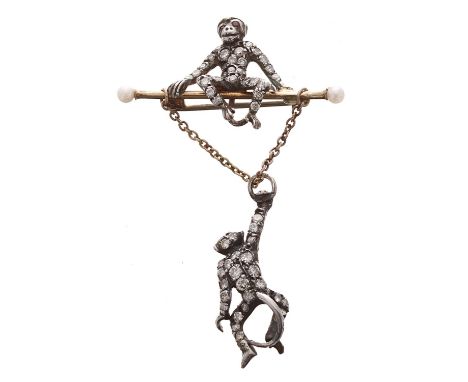 Good novelty diamond set swinging monkey brooch,&nbsp;the gold bar with pearls set to each end, perched with a seated monkey 